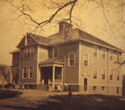The Center School was built in 1902 and was located right in the center of town at 18 West Main St. When it was initially built at a cost of $13,000, it only had 4 rooms, but only 3 were furnished. Grades 1-3 were in one room, 4-6 in another, and 7-9 in another. This was the first school in Norton to have a "High School'', so the 9th graders in 1902 were the first to graduate Norton High School in 1906. Prior to this school being built, the town would pay to send students who wanted a higher education to high schools in other towns. There were 8 districts in the town of Norton, and each district had their own one room schoolhouse that would only teach up to 8th grade. As the years went by, some of the school houses closed and the students were sent to the Center School. By 1914, the high school enrollment was up to 53 and they were all in one classroom, with 185 grammar school students in the other 3. Small rooms that were not designed for classrooms were also used including the corridors where typewriters were set up for the Commercial Department. In 1915, an additional $15,000 was allocated to expand the school by adding wings to both sides of the school. Sadly, this school was abandoned after the new high school was built in the 1950s and the building was razed in 1966. In 1972, the #3 District Schoolhouse was moved to this location from South Worcester St and has served as the home of the Norton Historical Society ever since.